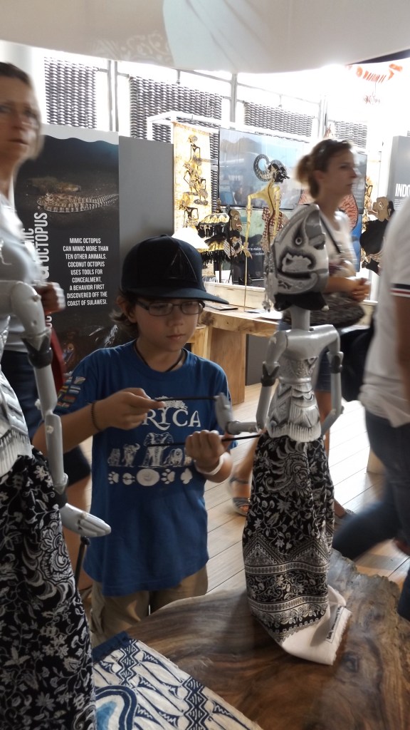 Playing with puppets in the Vietnam Pavilion 